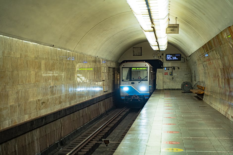 A subway train approaches a Moscow metro station platform, capturing urban transit dynamics.